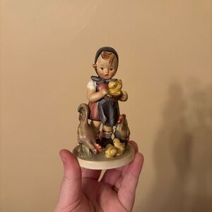 “Feeding Time" Hummel figurine manufactured by Goebel